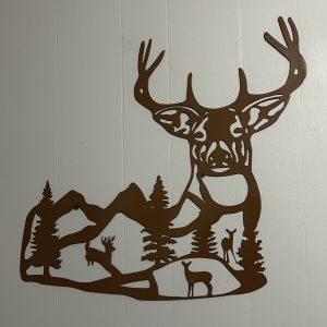 Buck silhouette with mountains inside