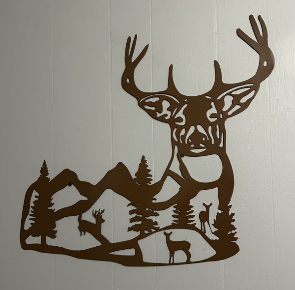 Buck silhouette with mountains inside