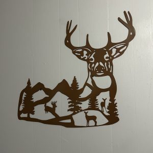 Buck silhouette with mountains inside